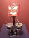 red drumming tiki god