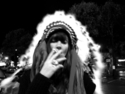 Mariana Sparre - Photography black and white photo, photo, figure, figurative photography, girl, woman, female, party,smoking, head dress, native american, smoke, indian, smokey, cigarette, weed , marijuana, pot, feathers, peace pipe, head gear, hat - Photography