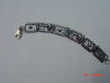 Hand%20cut%20sterling%20silver%20bracelet%20with%20sapphires. (thumbnail)