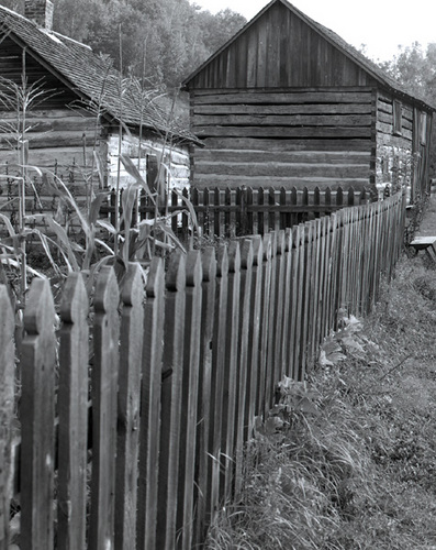 Photography-Picket fence and log building, Norskedalen, Coon Valley, Wisconsin 1989 0904c