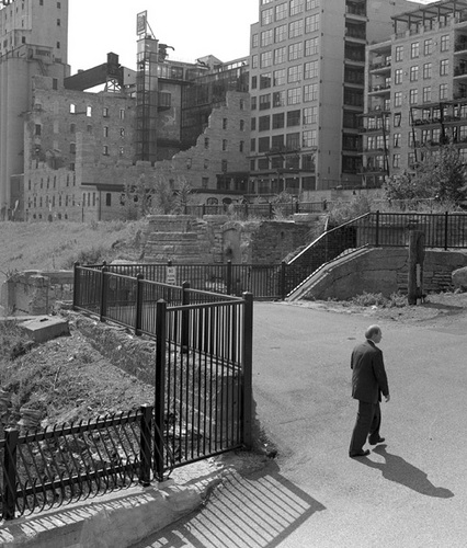 Photography-Figurative-Man and grain mill ruins, Minneapolis r07-0813-3