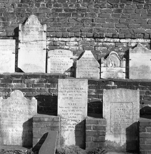 Photography-Urban-r09-0216b-47 Headstones on wall, Colonial Cemetery, Savannah, Georgia