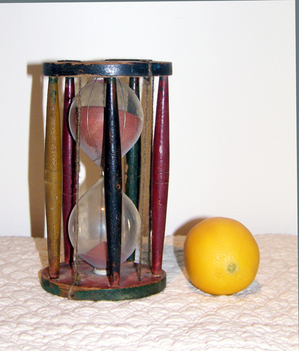 Antique hourglass with polychrome paint