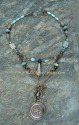 A handmade necklace in a nautical theme just in time for summer.  This twenty four inch antique brass necklace is wire wrapped with a unique custom made compass pendant, amazonite, aquamarine, apatite, picture and aqua terra jasper.  (thumbnail)