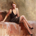 Seated Model in Black Dress