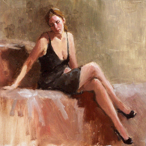 Seated Model in Black Dress