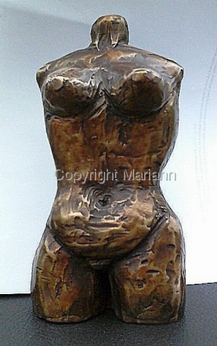Bronze sculpture by Mariann. 2011. From the Protector Series: Woman as healer and protector.  She answers the suffering of life with strength and courage; she takes flight in joy. (large view)