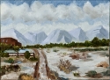 A dirt track leads towards distant mountains (thumbnail)