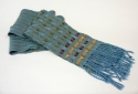 Blue-green%20scarf%20with%20red%20and%20gold%20tufts (thumbnail)