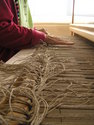 Tying warp on front apron.