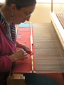 Final step before removing the tapestry from the loom.