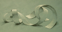 Drawing--PastelsChiaroscuro Drawing, White Chalk and Charcoal on Toned Paper: Drawing curved strips of paper, students learn to render highlights and shadows in black and white while allowing the color of the paper to function as a mid-tone.