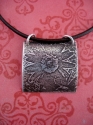 Daisy%20Pendant%20on%20Leather (thumbnail)