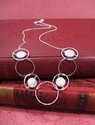 Circle%20Necklace%20with%20Coin%20Pearls%20on%20leather%20cord (thumbnail)