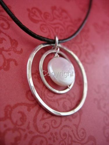 Floating%20%20Sterling%20Circles%20on%20Leather%20with%20Coin%20Pearl (large view)